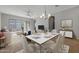 Bright dining area with hardwood floors and modern chandelier at 4267 E Bernice St, Gilbert, AZ 85295