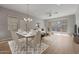 Spacious dining area with hardwood floors and modern chandelier at 4267 E Bernice St, Gilbert, AZ 85295