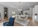 Elegant dining room with hardwood floors and modern chandelier at 4267 E Bernice St, Gilbert, AZ 85295