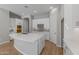 Modern kitchen with white cabinets and a large kitchen island at 4267 E Bernice St, Gilbert, AZ 85295