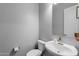 Clean and modern half bathroom with white vanity and updated fixtures at 4362 E Clifton Ave, Gilbert, AZ 85295