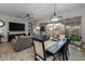 Open concept dining area with a rustic wooden table at 4362 E Clifton Ave, Gilbert, AZ 85295