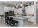 Modern kitchen with white cabinets, granite countertops, and stainless steel appliances at 4362 E Clifton Ave, Gilbert, AZ 85295