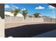 Spacious backyard with gravel and a block wall at 44478 W Palo Abeto Dr, Maricopa, AZ 85138