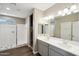 Modern bathroom with double vanity and walk-in shower at 44478 W Palo Abeto Dr, Maricopa, AZ 85138