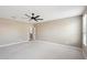 Spacious bedroom with ceiling fan and neutral walls at 44478 W Palo Abeto Dr, Maricopa, AZ 85138