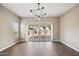 Dining room with tile floors and sliding glass doors to backyard at 44478 W Palo Abeto Dr, Maricopa, AZ 85138