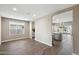 Spacious dining room with wood-look tile floors at 44478 W Palo Abeto Dr, Maricopa, AZ 85138