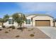 Single-story house with a two-car garage and desert landscaping at 44478 W Palo Abeto Dr, Maricopa, AZ 85138