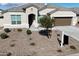 Single-story home with a two-car garage and desert landscaping at 44478 W Palo Abeto Dr, Maricopa, AZ 85138