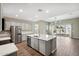 Modern kitchen with stainless steel appliances and an island at 44478 W Palo Abeto Dr, Maricopa, AZ 85138