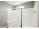 Large walk-in shower with glass enclosure and seat at 44478 W Palo Abeto Dr, Maricopa, AZ 85138