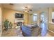 Living room boasts a fireplace and view into the kitchen at 4711 E Silverwood Dr, Phoenix, AZ 85048