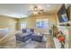 Living room with fireplace, sectional sofa, and tile floors at 4711 E Silverwood Dr, Phoenix, AZ 85048