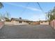 Large backyard with gravel and a view of the house at 4901 E Sheridan St, Phoenix, AZ 85008