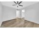 Simple bedroom with light flooring and a ceiling fan at 4901 E Sheridan St, Phoenix, AZ 85008