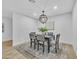 Modern dining room with dark wood table and gray chairs at 4901 E Sheridan St, Phoenix, AZ 85008