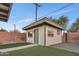 Detached guest house with green door and artificial turf at 4901 E Sheridan St, Phoenix, AZ 85008