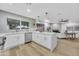 Open concept kitchen with island, white cabinets and stainless steel appliances at 4901 E Sheridan St, Phoenix, AZ 85008