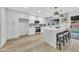 Modern kitchen with white cabinets, quartz countertops, and stainless steel appliances at 4901 E Sheridan St, Phoenix, AZ 85008