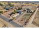 Aerial view of a property with barn, arena, and RV sites at 52615 W Esch Trl, Maricopa, AZ 85139