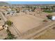 Aerial view of property showing house, large fenced area, and surrounding land at 52615 W Esch Trl, Maricopa, AZ 85139