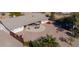 Backyard with patio, hot tub, fire pit, and desert landscaping at 52615 W Esch Trl, Maricopa, AZ 85139