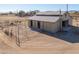 Aerial view of barn with stalls and paddocks at 52615 W Esch Trl, Maricopa, AZ 85139