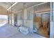 Interior view of barn stalls with hay at 52615 W Esch Trl, Maricopa, AZ 85139