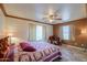 Bright bedroom with a queen-size bed and large closet at 52615 W Esch Trl, Maricopa, AZ 85139