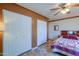 Bedroom with a queen-size bed and double closets at 52615 W Esch Trl, Maricopa, AZ 85139