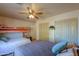 Spacious bedroom with two beds and large closets at 52615 W Esch Trl, Maricopa, AZ 85139