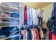 Large closet with hanging rods and shelving for storage at 52615 W Esch Trl, Maricopa, AZ 85139