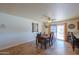 Bright dining area with sliding door access to patio at 52615 W Esch Trl, Maricopa, AZ 85139