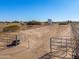 Long horse corral with metal fencing and gates at 52615 W Esch Trl, Maricopa, AZ 85139