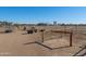 View of a horse corral with metal fencing and various equipment at 52615 W Esch Trl, Maricopa, AZ 85139