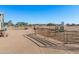 Spacious horse corral with metal fencing and water troughs at 52615 W Esch Trl, Maricopa, AZ 85139