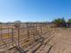 Large horse corral with metal fencing and gates at 52615 W Esch Trl, Maricopa, AZ 85139