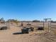 Horse corral with metal fencing, water troughs, and hay at 52615 W Esch Trl, Maricopa, AZ 85139