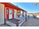 Inviting front porch with wooden railings and a welcome sign at 52615 W Esch Trl, Maricopa, AZ 85139