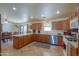 Kitchen with island and view into dining area at 52615 W Esch Trl, Maricopa, AZ 85139