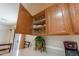 Upper corner cabinet with glasses and dishes at 52615 W Esch Trl, Maricopa, AZ 85139