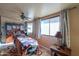 Sunroom featuring a massage table and ample natural light at 52615 W Esch Trl, Maricopa, AZ 85139