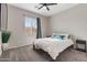 Spacious bedroom with a queen bed and plenty of natural light at 5758 W Kowalsky Ln, Laveen, AZ 85339