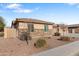 Side view of a house with stone and stucco exterior, and landscaping at 5758 W Kowalsky Ln, Laveen, AZ 85339