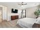 Main bedroom with dresser and large TV at 5758 W Kowalsky Ln, Laveen, AZ 85339