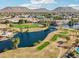 Aerial view of a lake and golf course community at 6270 W Rose Garden Ln, Glendale, AZ 85308