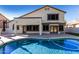 Inviting outdoor area boasting a serene swimming pool, spacious patio, and lush greenery at 6270 W Rose Garden Ln, Glendale, AZ 85308