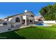 Beautiful outdoor area featuring a built-in barbeque island and refreshing swimming pool at 6270 W Rose Garden Ln, Glendale, AZ 85308