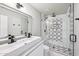 Modern bathroom with a patterned tile shower and double vanity at 6270 W Rose Garden Ln, Glendale, AZ 85308